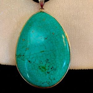 Enhanced turquoise drop pendant necklace.